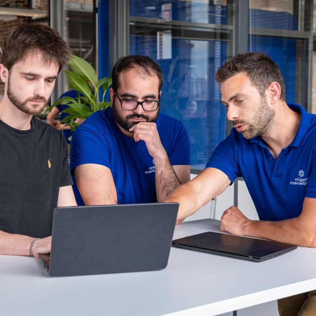 Photo of the origami marketplace team in a meeting with a technical partner.
